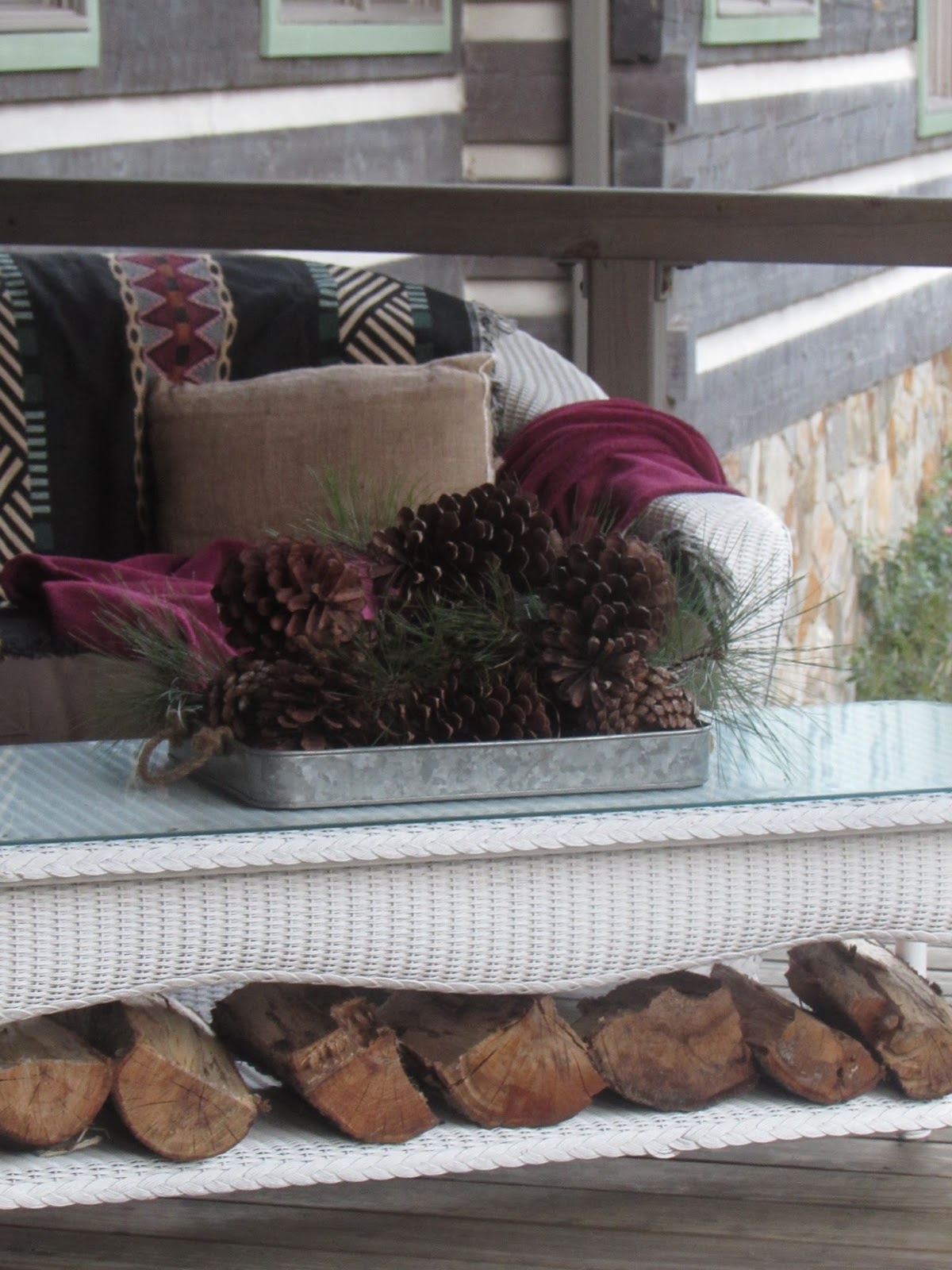 Rustic Vignette with Pinecones, Branches, and Logs Rustic Vignette with Pinecones, Branches, and Logs — Winter Porch Decor