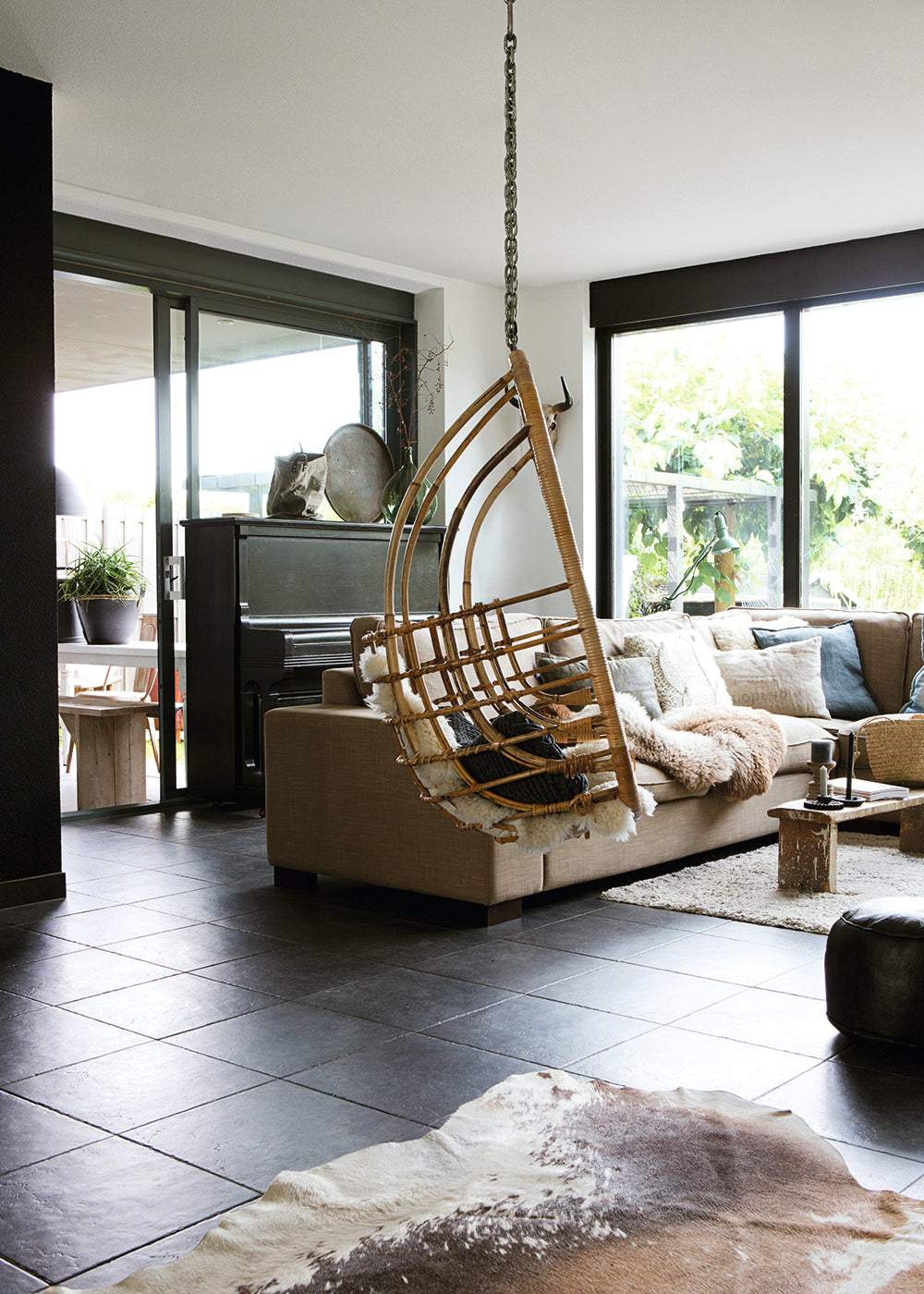 Hygge Living with Hanging Rattan Chair and Cowhide Rug — Hygge Home Decor