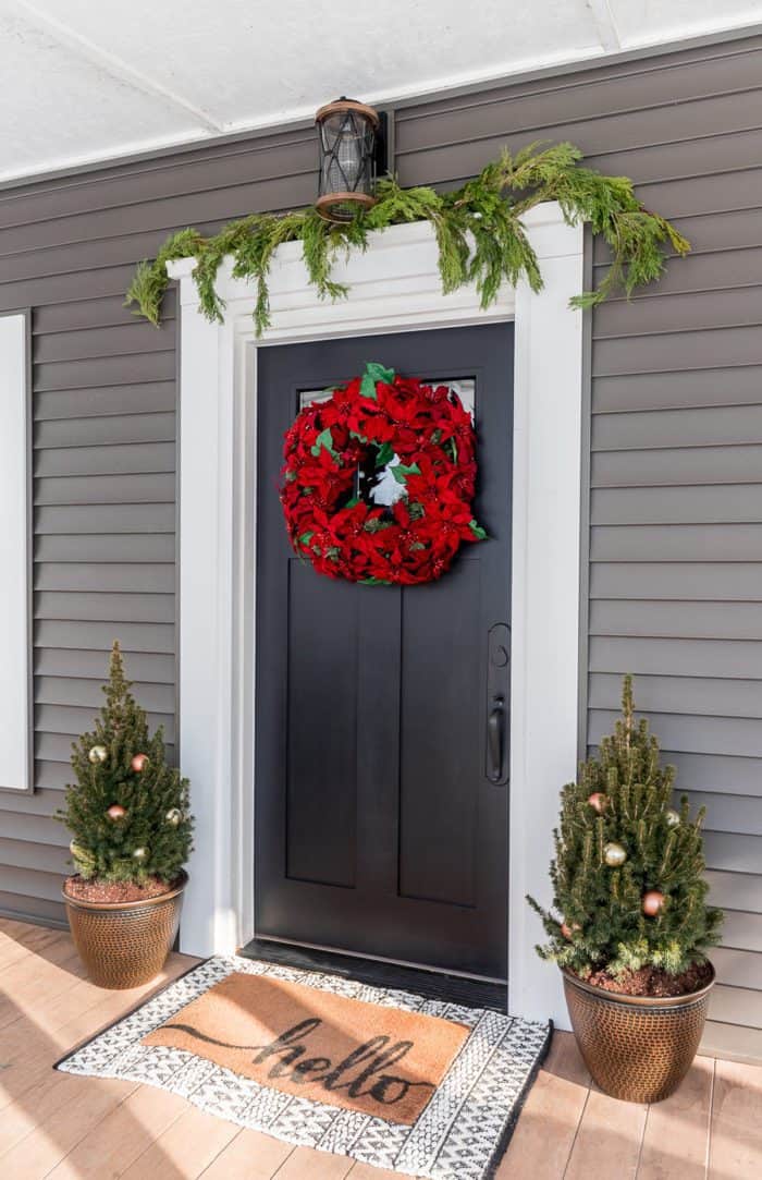 Classic Charm with Red Poinsettia Wreath and Decorated Trees — Winter Front Door Decor