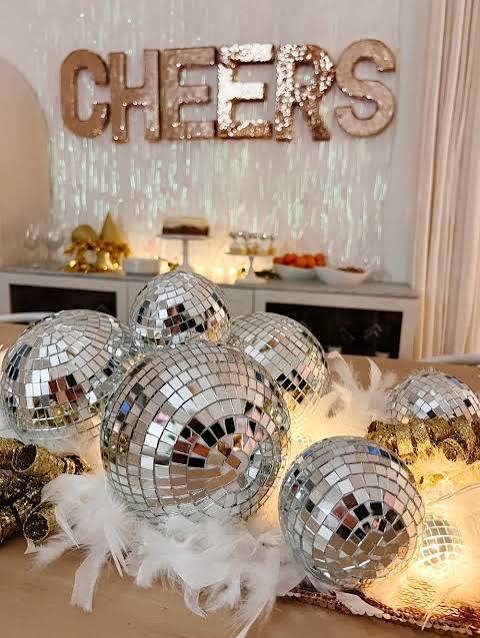 Mirror Disco Balls and Gold 'CHEERS' Sign for a Party Vibe — Gold New Years Eve Decor