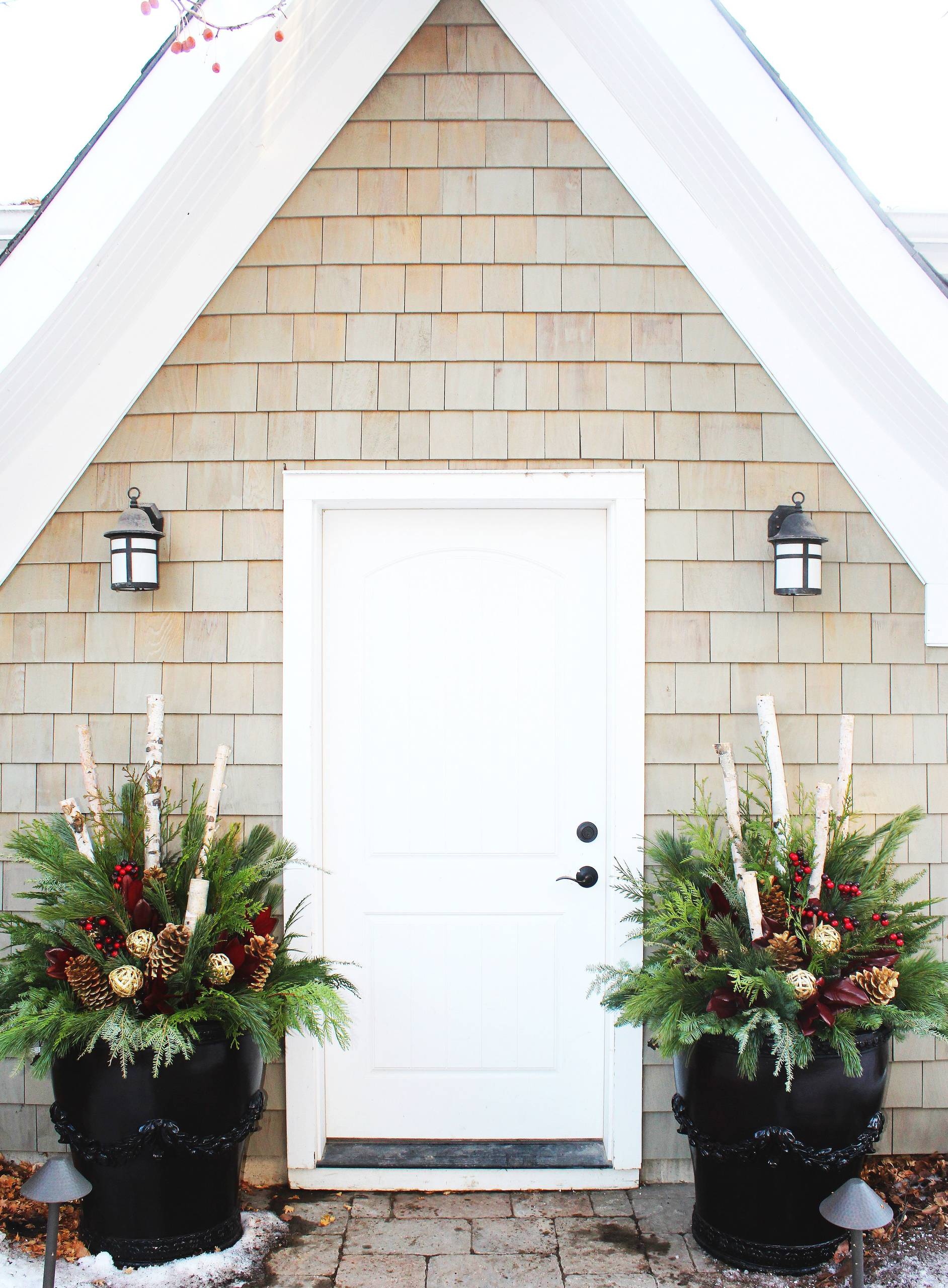Modern Entrance with Symmetrical Black Planters — Winter Front Door Decor