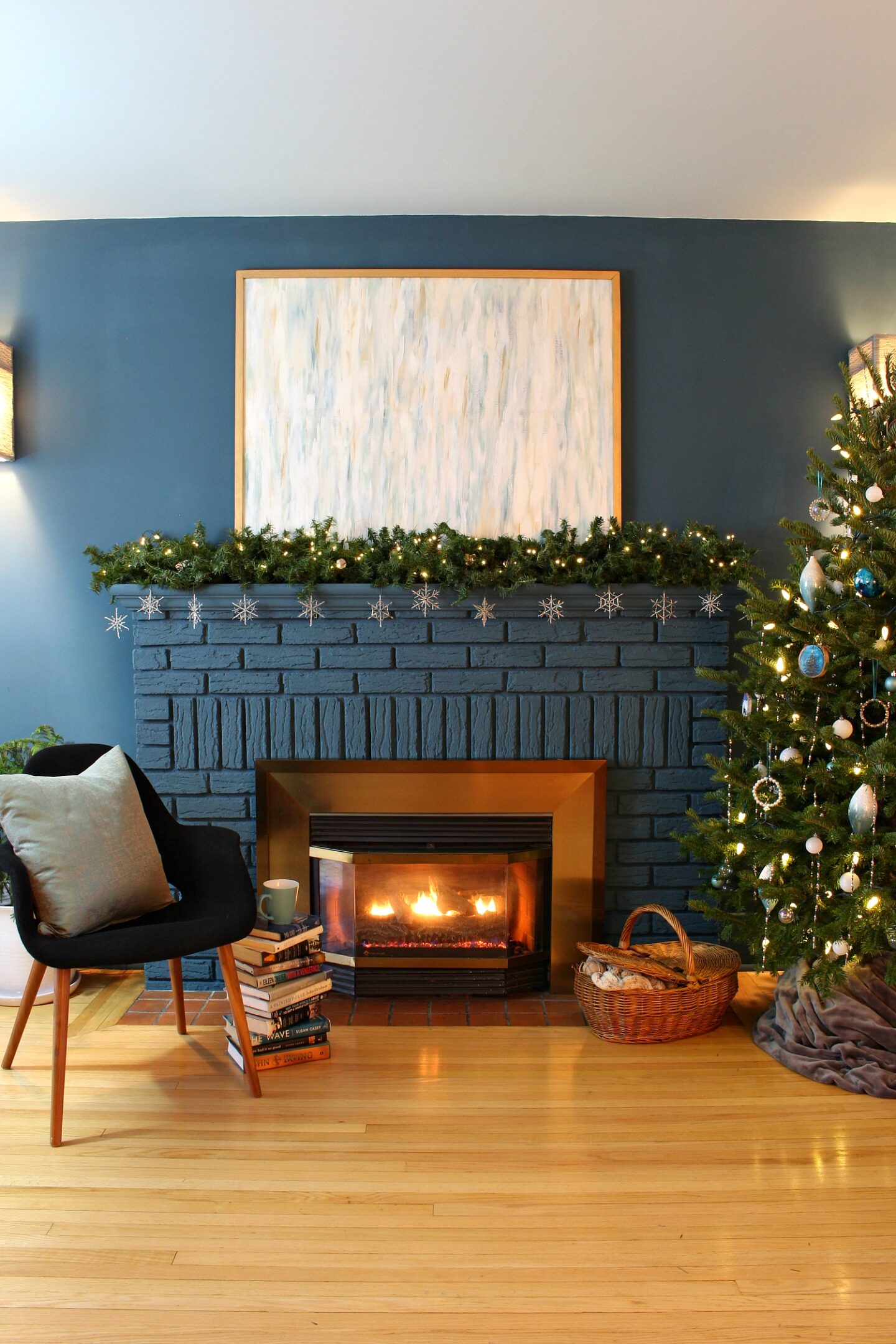Eclectic Mantel with Blue Brick, Garland, and Snowflakes — Winter Mantel Decor