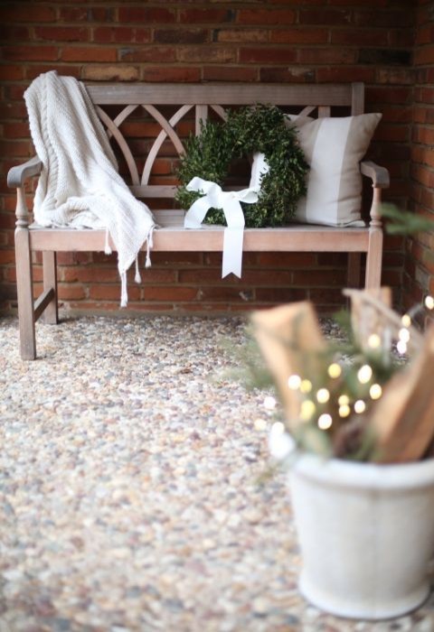 Minimalist Bench with Boxwood Wreath and Knit Blanket Minimalist Bench with Boxwood Wreath and Knit Blanket — Winter Porch Decor