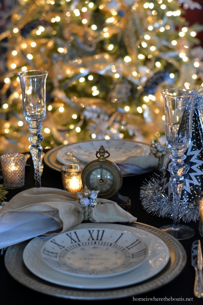 Elegant Table Setting with Clock-Themed Plates and Bokeh Lights — New Years Eve Party Decor