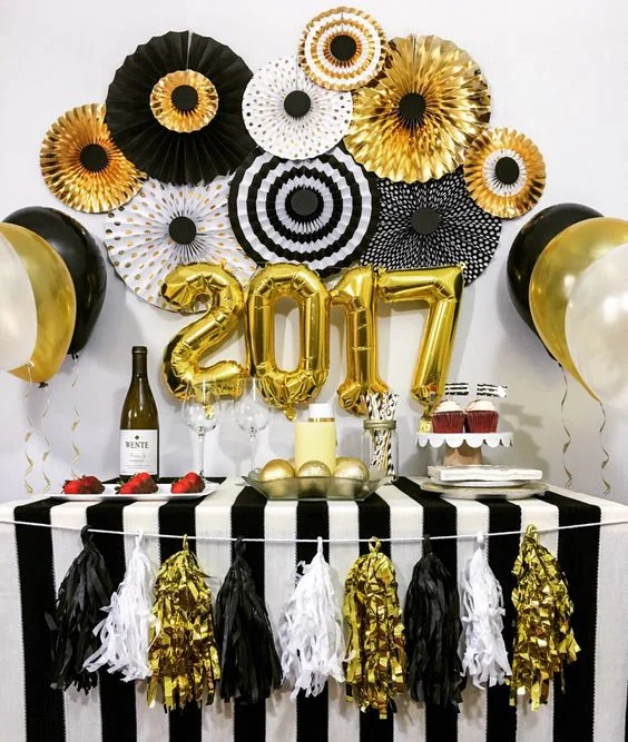 Large Gold Foil '2017' Balloons and Paper Fans for a Party Setup — Gold New Years Eve Decor