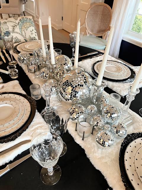 Glamorous Centerpiece of Silver Disco Balls and Tall Candles — New Years Eve Party Decor