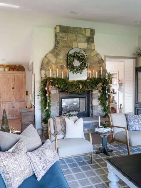 Stone Fireplace Mantel with Greenery Garland and Candles — Winter Mantel Decor