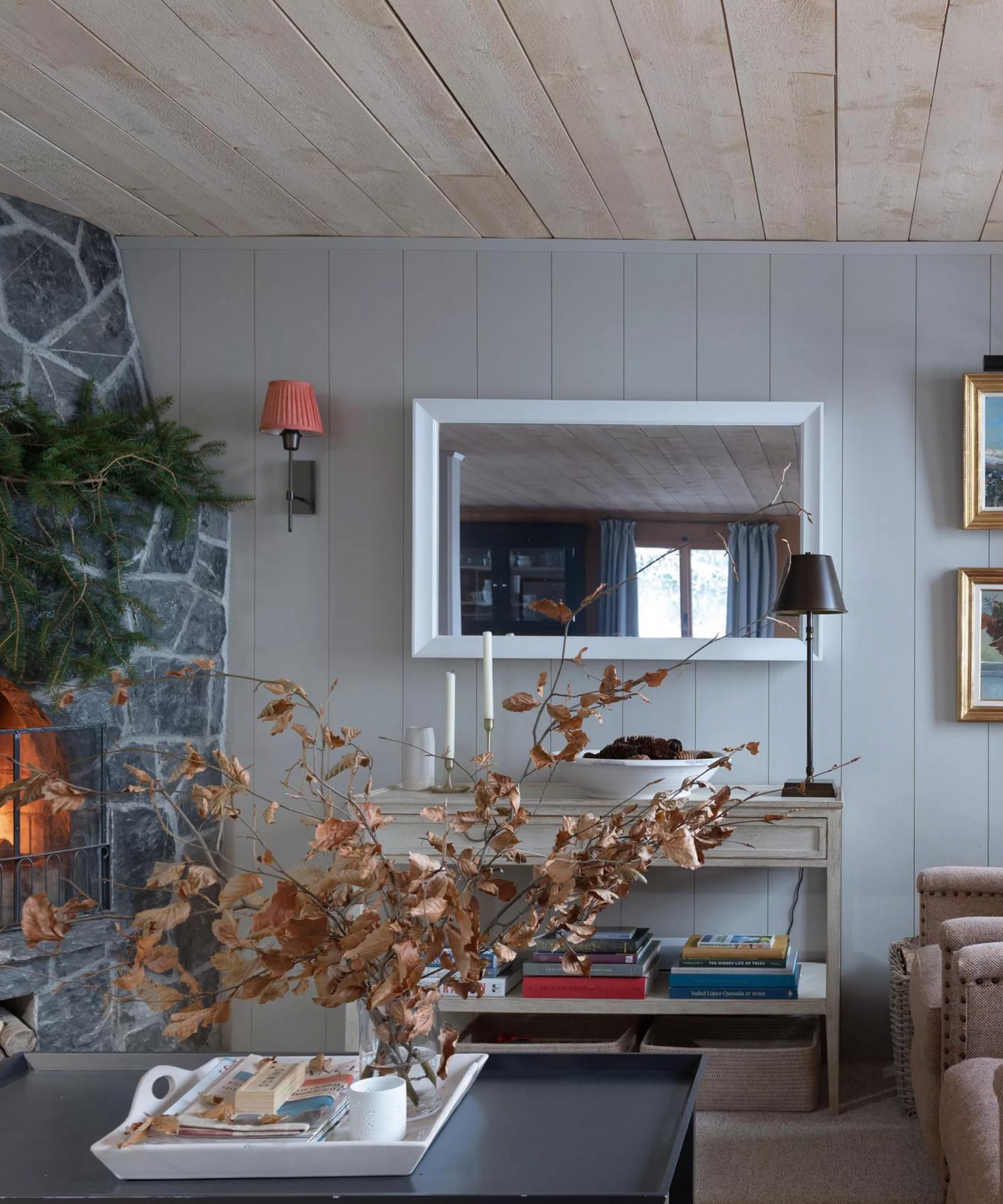 Rustic Living Room with Stone Fireplace and Evergreen Wreath — Winter Home Decor