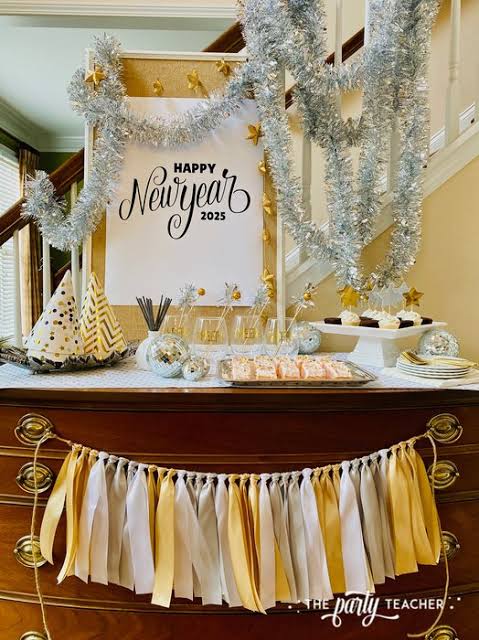 Festive Tabletop Dessert Spread with Party Hats and Garland — New Years Eve Party 2027