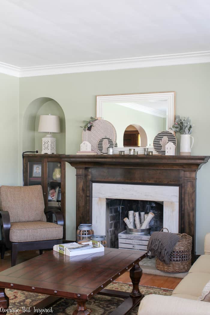Traditional Dark Wood Mantel with Decorative Houses and Mirror — Winter Mantel Decor