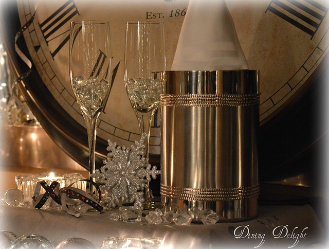 Elegant Champagne Flutes and Ice Bucket with Clock Face Backdrop — Gold New Years Eve Decor