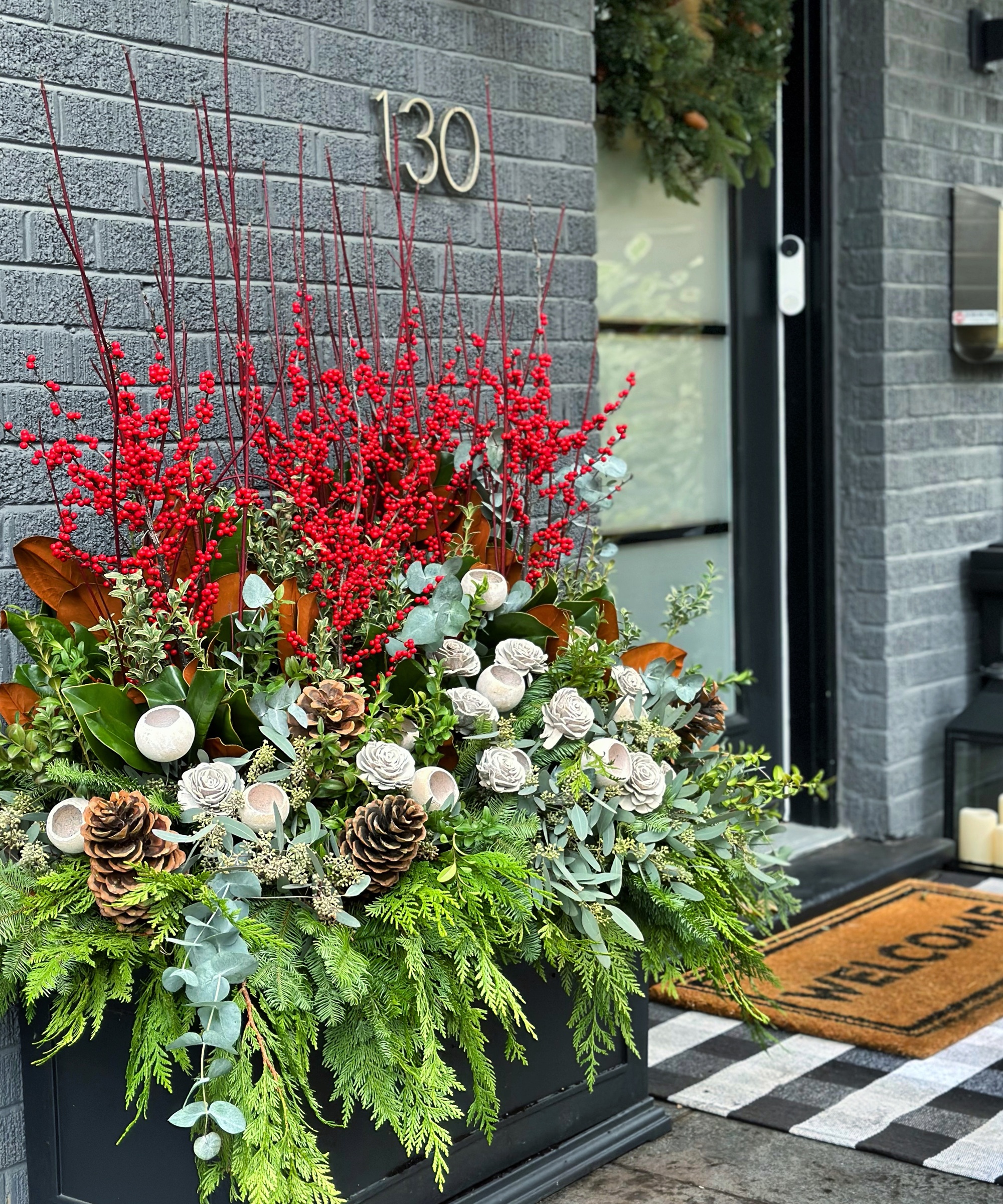 Modern Planter Arrangement with Berries and Magnolia Modern Planter Arrangement with Berries and Magnolia — Winter Porch Decor