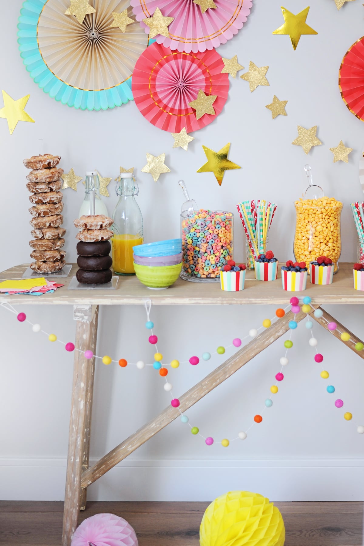 Abundant Dessert and Snack Table with Colorful Paper Fans — New Years Eve Party 2027