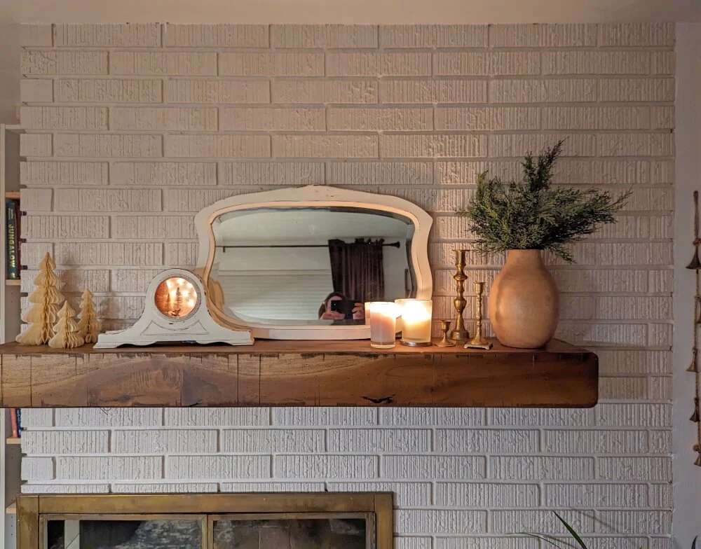 Rustic White Brick Mantel with Mirror, Clock, and Greenery — Winter Mantel Decor