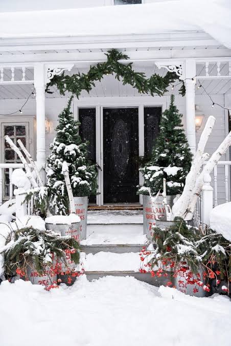 Snow-Covered Farmhouse Porch with Black Double Doors — Winter Front Door Decor