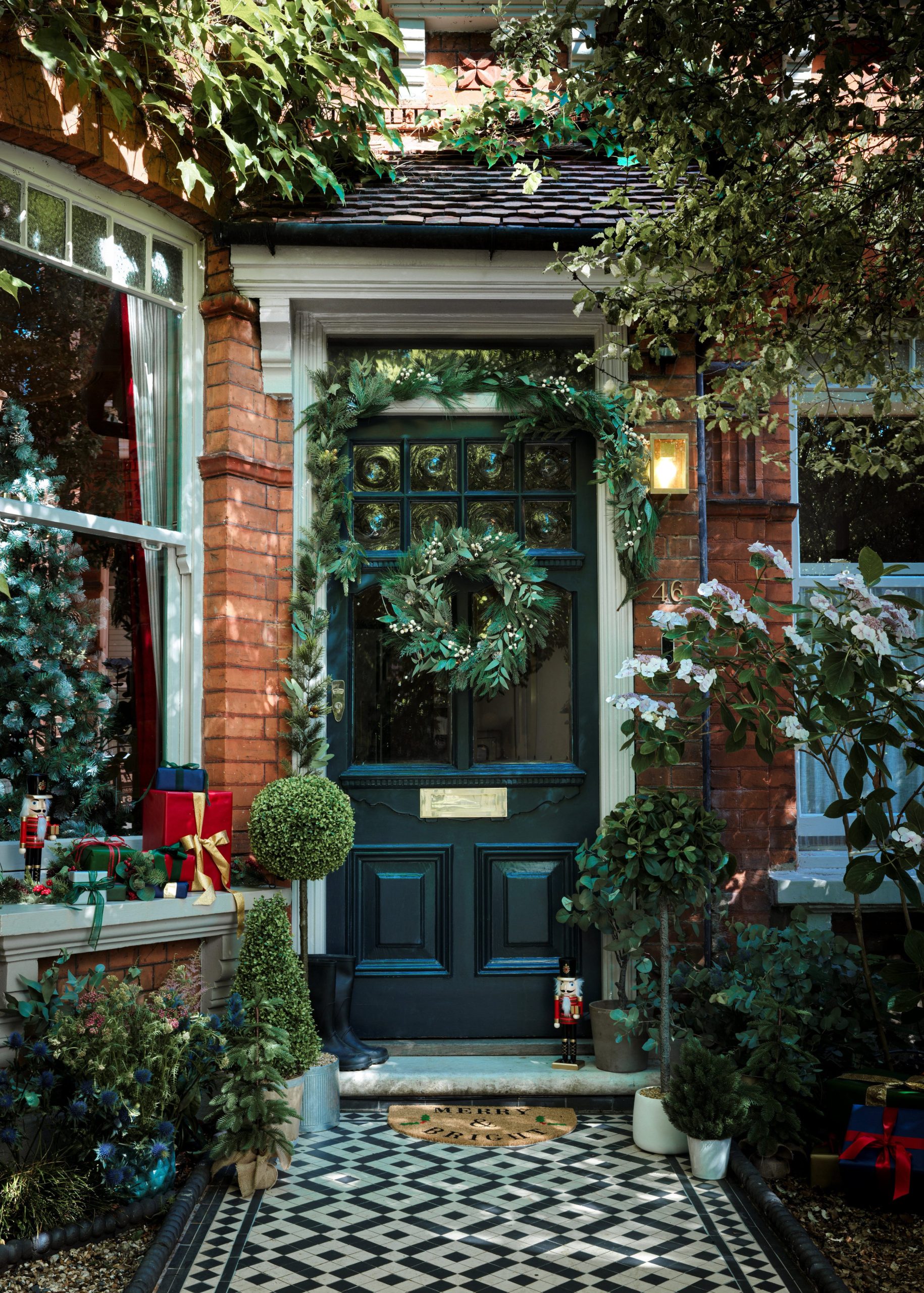 Traditional Porch with Nutcracker Figures and Potted Trees — Winter Front Door Decor