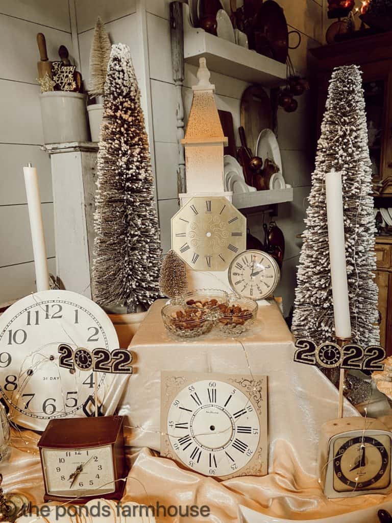 Rustic Vignette with Vintage Clocks and Bottle Brush Trees — New Years Eve Party Decor