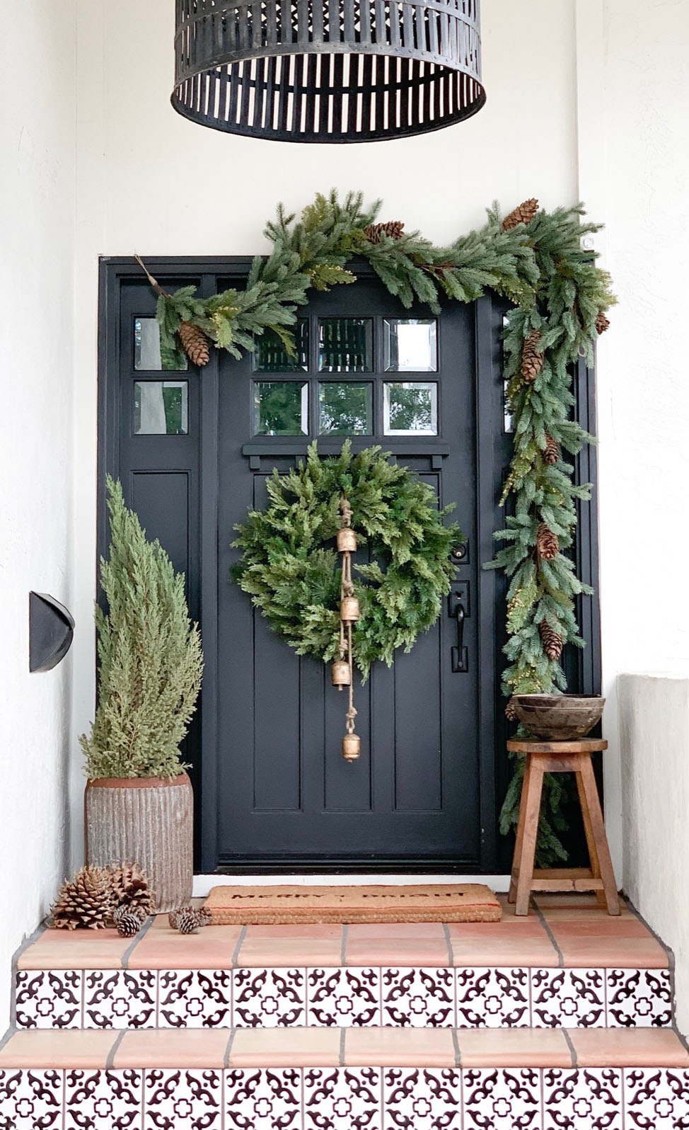 Modern Porch with Bold Black Door and Greenery Modern Porch with Bold Black Door and Greenery — Winter Porch Decor
