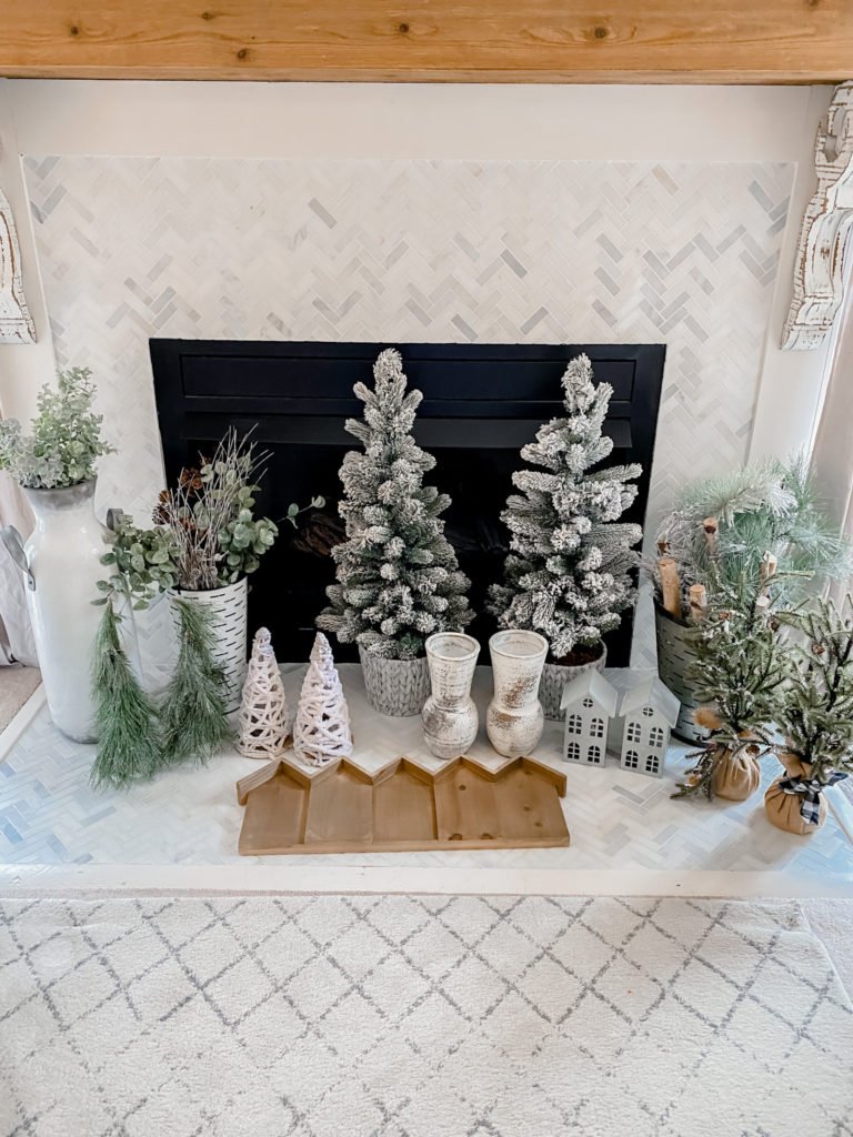 Neutral Modern Farmhouse Mantel with Flocked Trees and Houses — Winter Mantel Decor