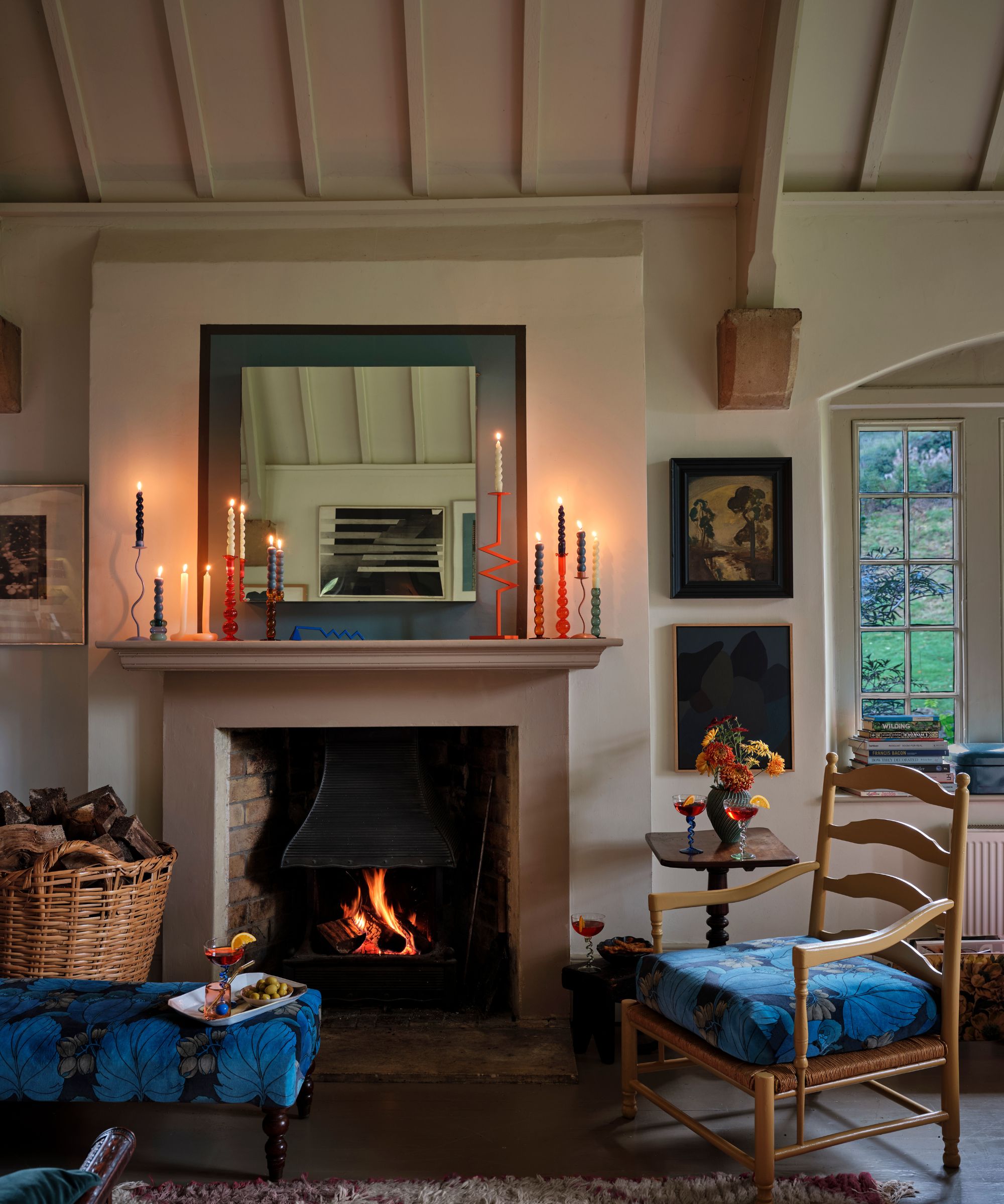 Eclectic Mantel with Colorful Candles and Artwork — Winter Mantel Decor