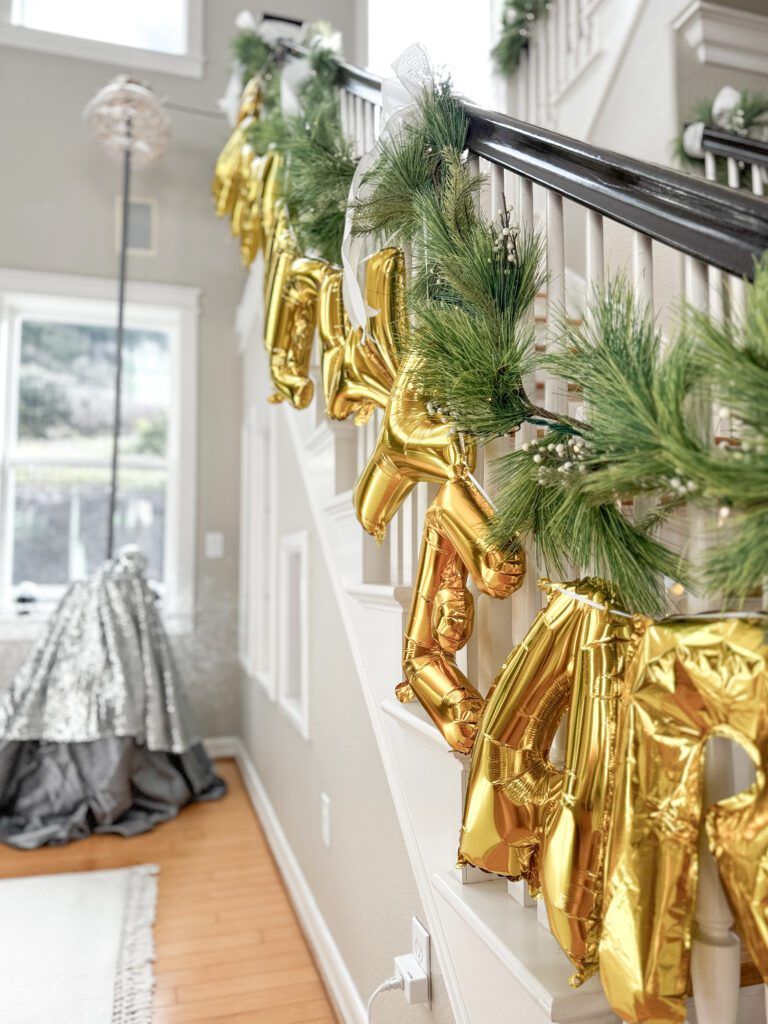 Gold Foil 'Happy New Year' Garland on Staircase Railing — New Years Eve Balloon Garland