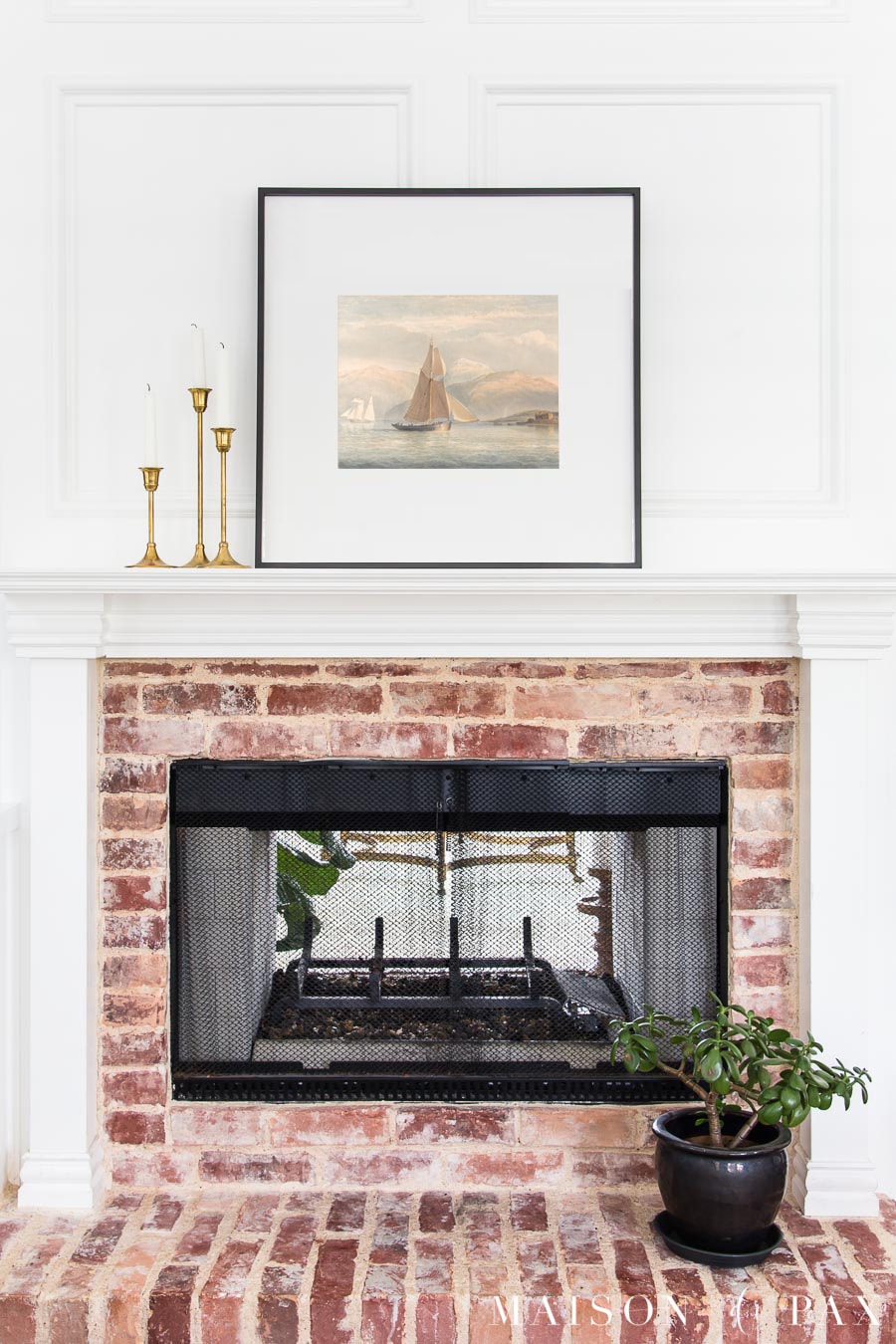 Traditional White Mantel with Nautical Art and Brass Candlesticks — Winter Mantel Decor