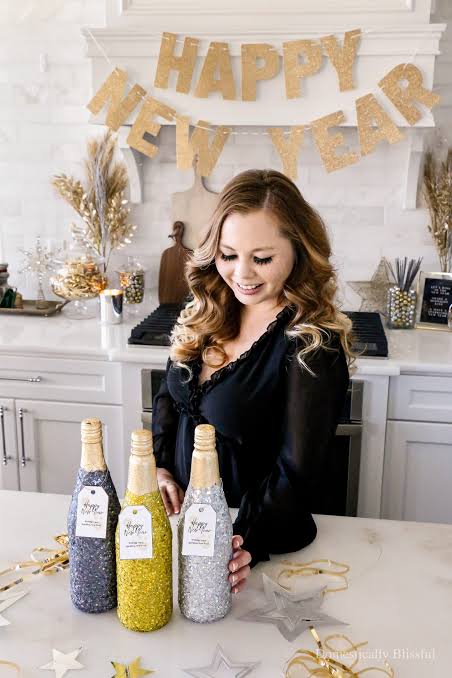 Sparkling Glitter-Covered Bottles and 'Happy New Year' Banner — New Years Eve Party 2027