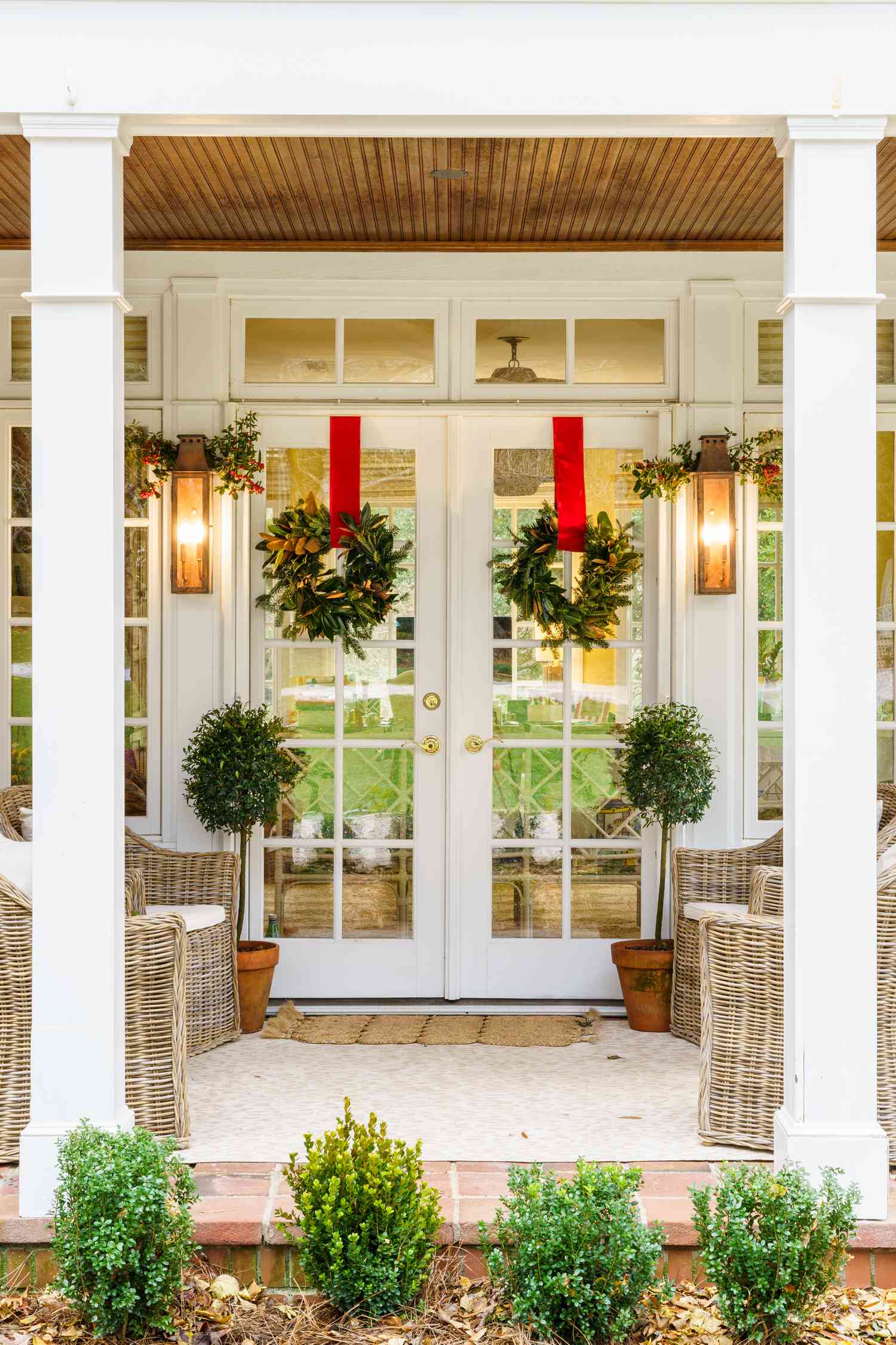 Symmetrical Double Doors with Large Magnolia Wreaths — Winter Front Door Decor