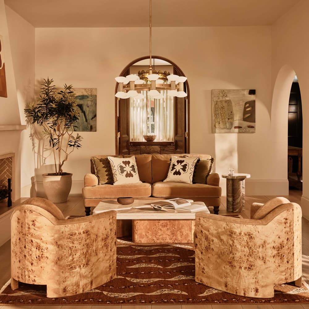 Eclectic Living Room with Vibrant Orange Walls and Patterned Sofa — Winter Home Decor