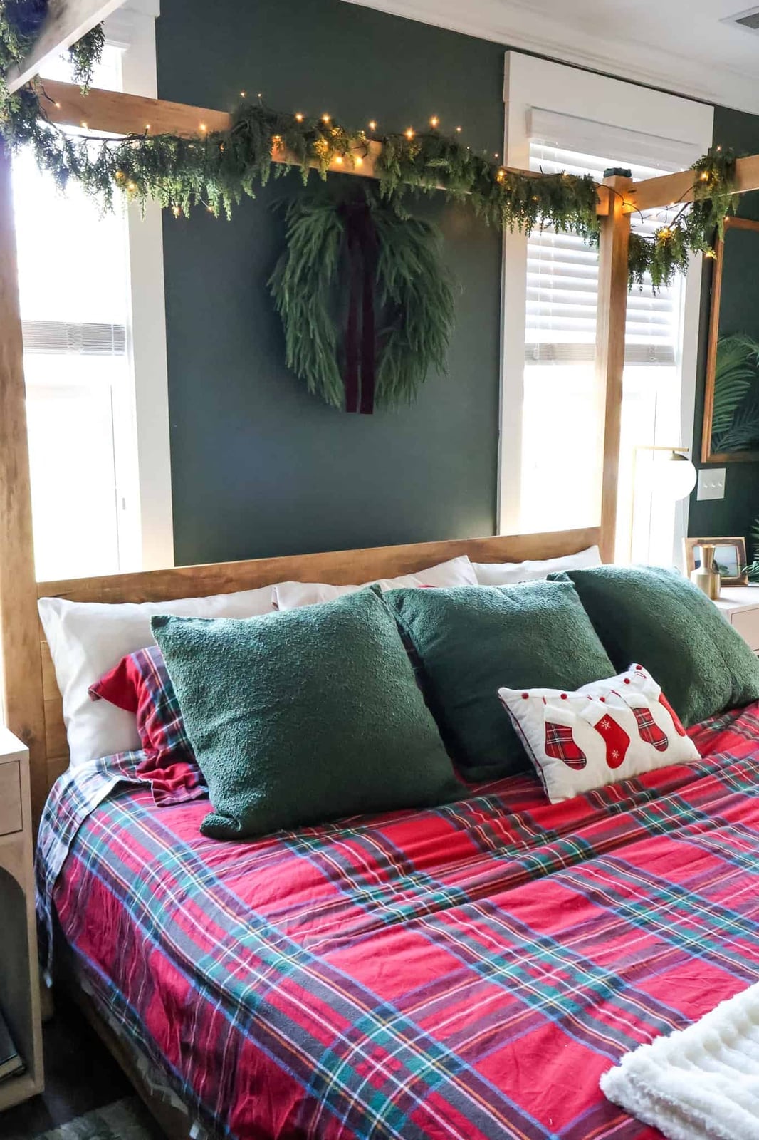 Modern Rustic Bedroom with a Wooden Canopy Bed and Green Boucle — cozy christmas bedroom 2026