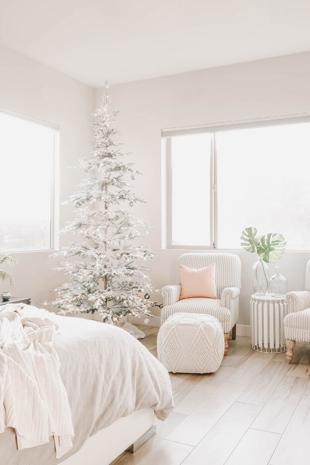 Scandinavian Minimalist Bedroom with a Flocked Christmas Tree — cozy christmas bedroom 2026
