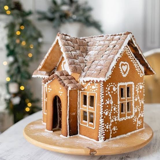 Traditional Gingerbread House as a Table Centerpiece — gingerbread christmas decor ideas 2026