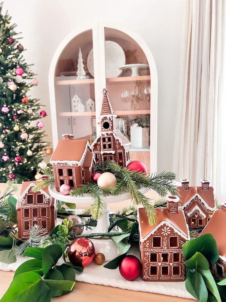Modern Farmhouse Gingerbread Village on Cake Stand — gingerbread christmas decor ideas 2026