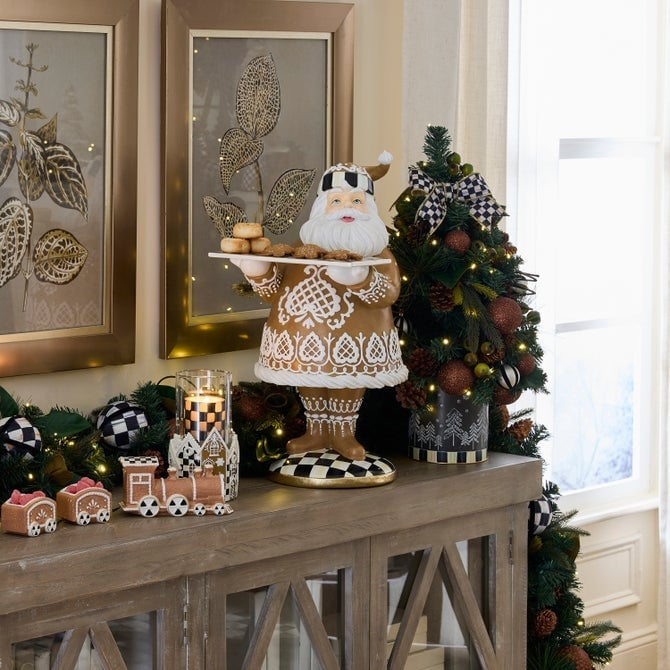 Traditional Mantelpiece with Santa Figurine and Gingerbread Train — gingerbread christmas decor ideas 2026