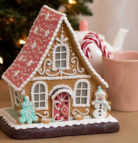Rustic Shelf Display of Illuminated Gingerbread Houses — gingerbread christmas decor ideas 2026