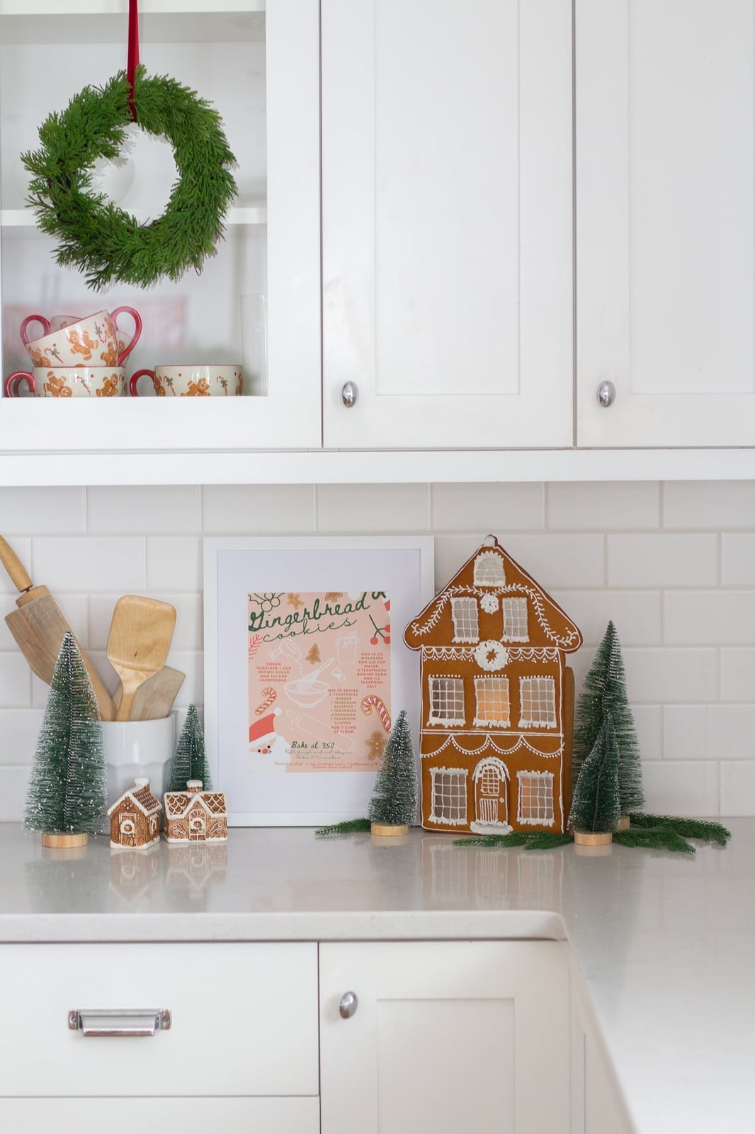 Kitchen Counter Gingerbread House and Bottle Brush Tree Display — gingerbread christmas decor ideas 2026