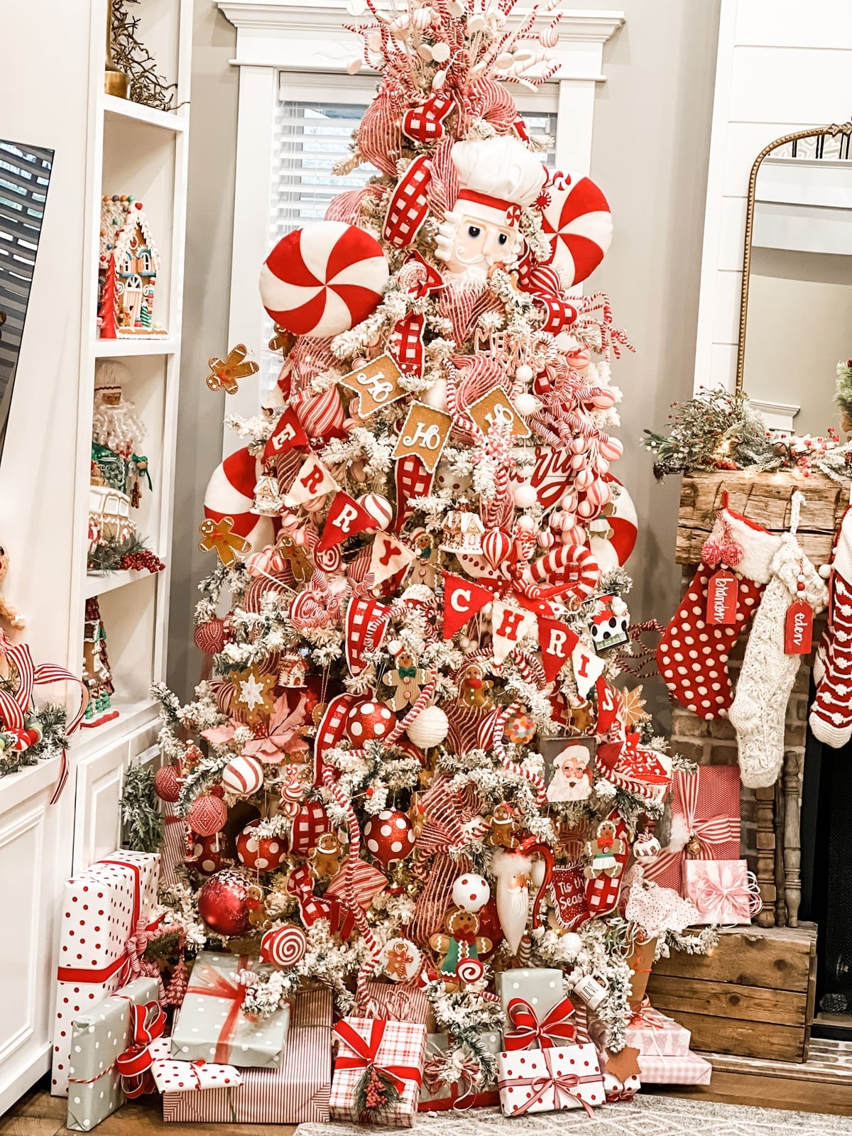 Whimsical Flocked Tree with Gingerbread and Candy Accents — gingerbread christmas decor ideas 2026